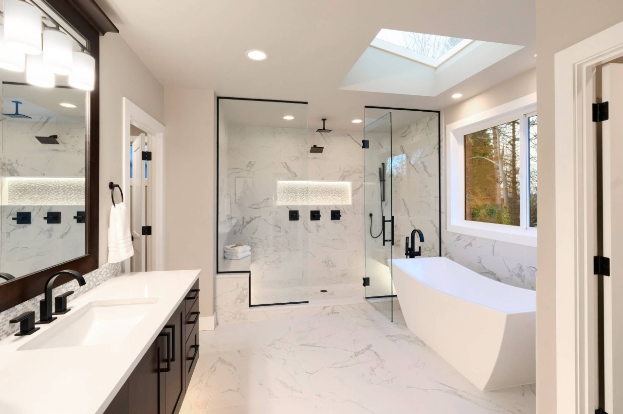  A modern bathroom with a clear window and a walk-in shower at Bell's Ethan Allen Design Center near Newburgh, NY